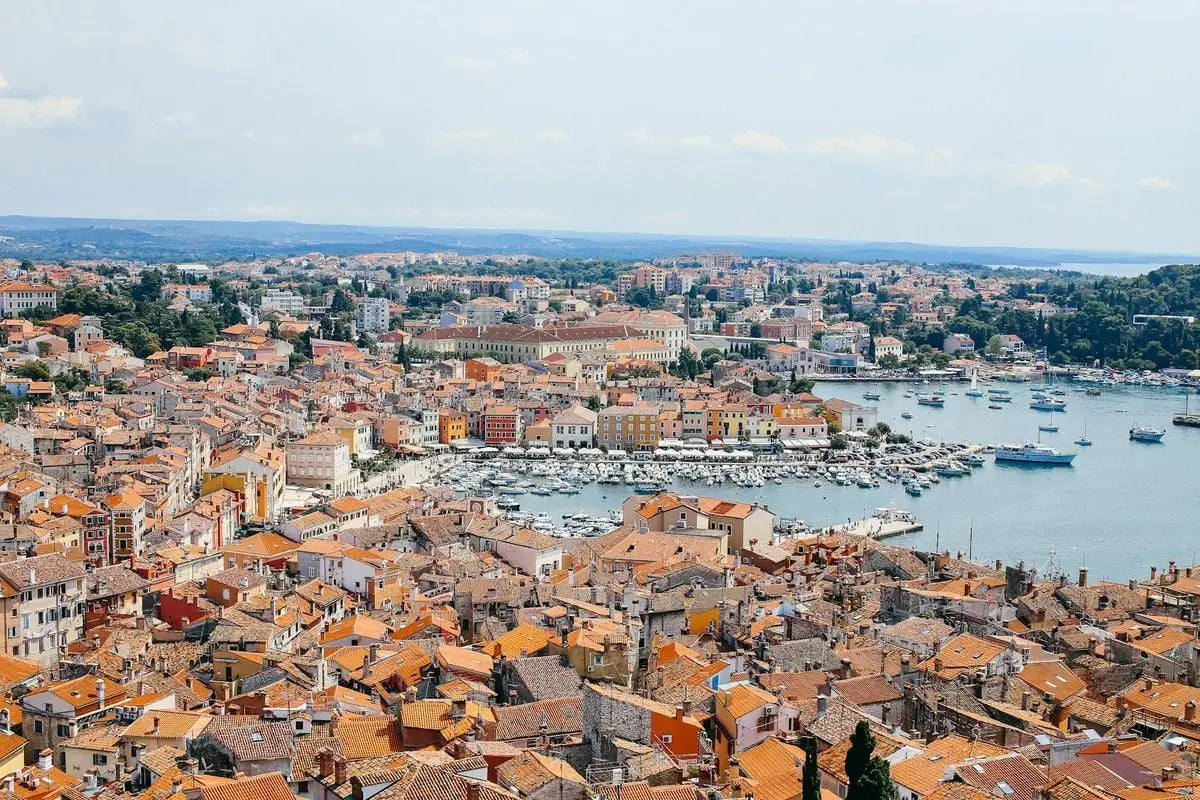 A breathtaking aerial view of Rovinj with its iconic red rooftops and serene harbor.