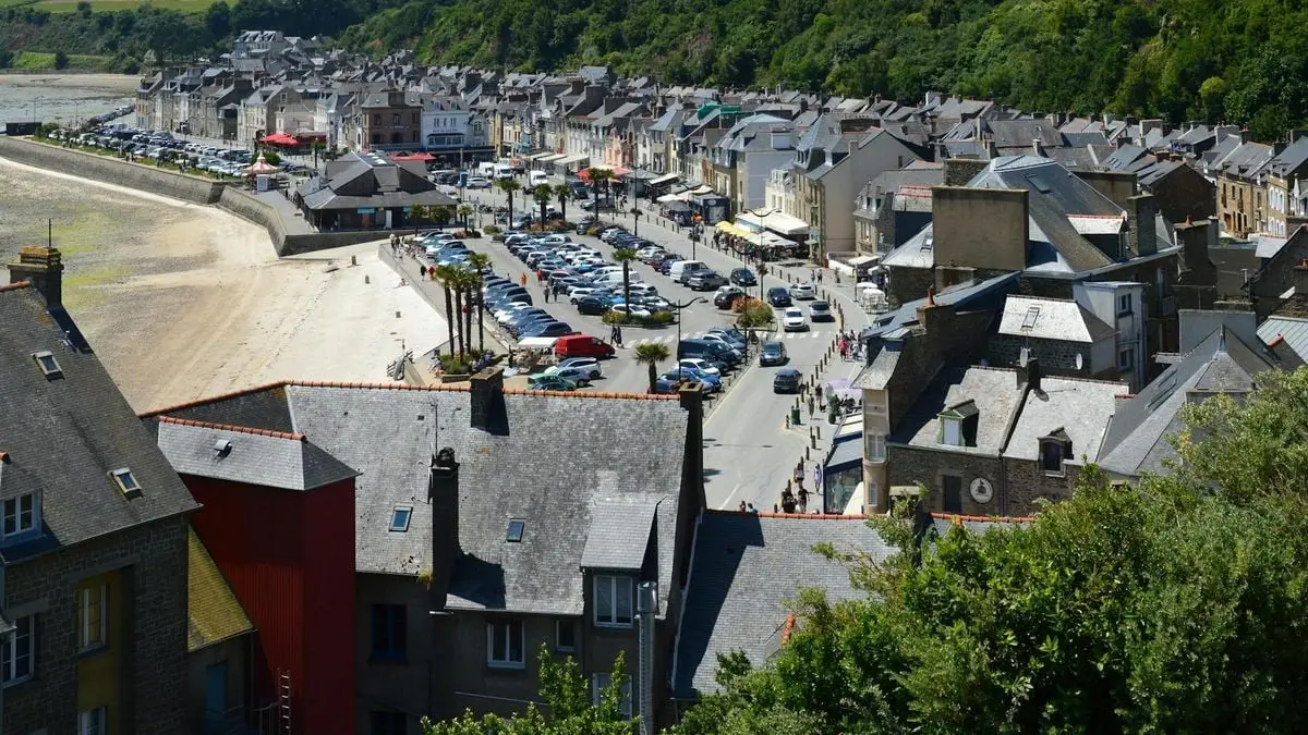 Aerial view of Cancale, France, featuring charming rooftops and coastal scenery, perfect for travel enthusiasts.