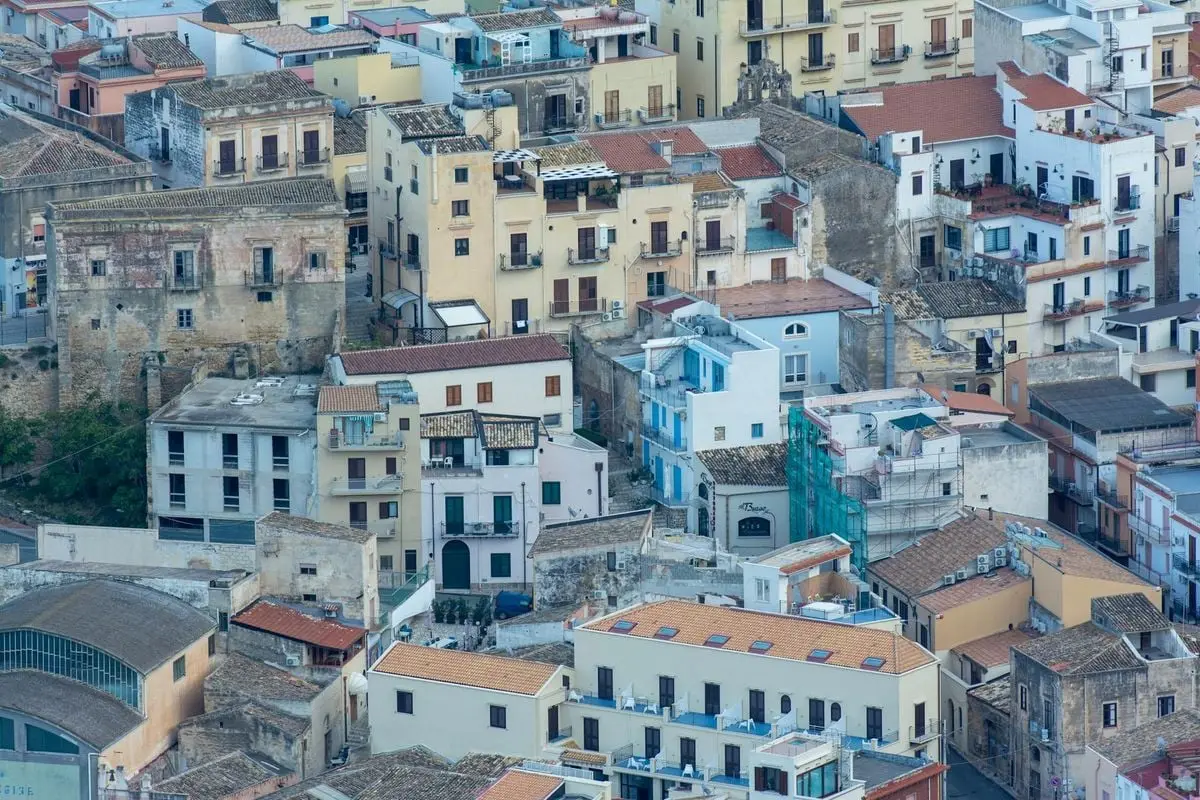 Detailed aerial view of historic buildings in Castellammare del Golfo, Sicily.