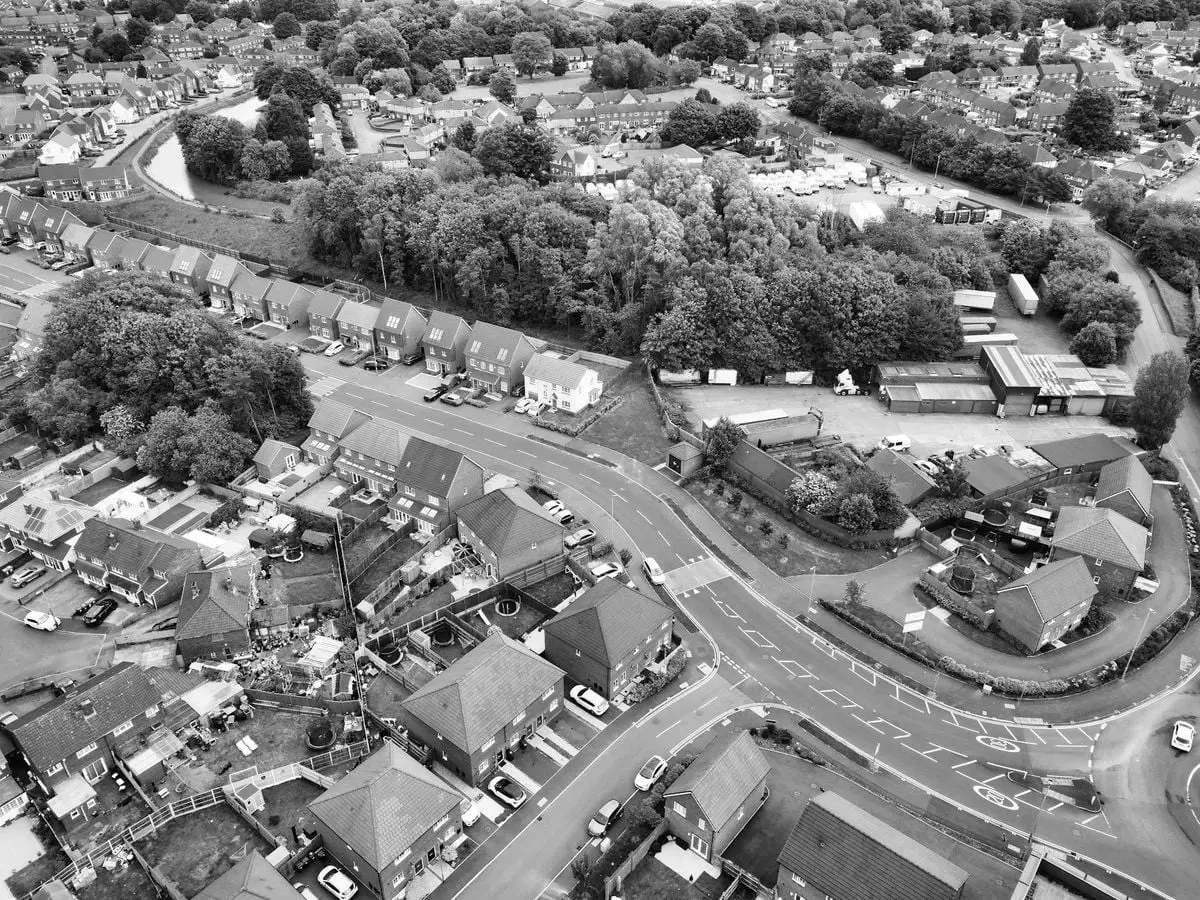 Black and white aerial photo capturing a suburban area in West Midlands, England.