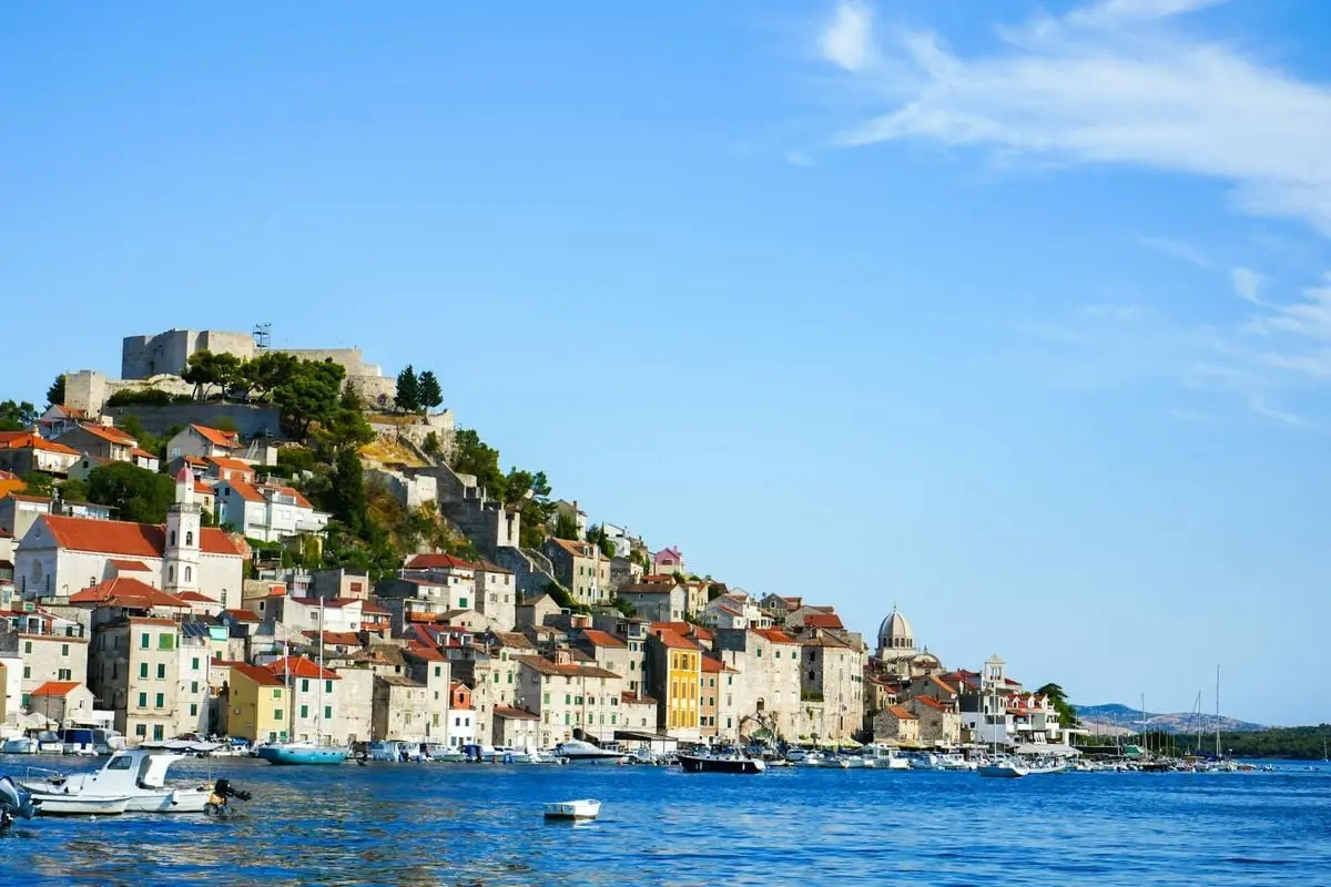 Explore the charming architecture and scenic beauty of Šibenik, Croatia from the waterfront.