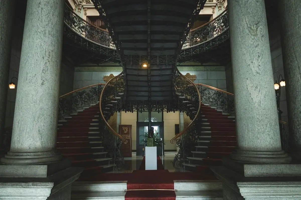 Grand staircase with ornate design in historic government building, Belo Horizonte.