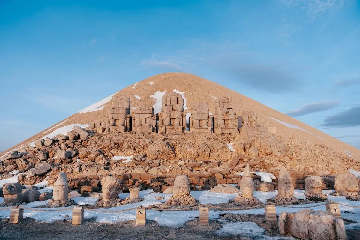 Explore the historical stone statues atop Mount Nemrut, a UNESCO World Heritage Site with breathtaking views.