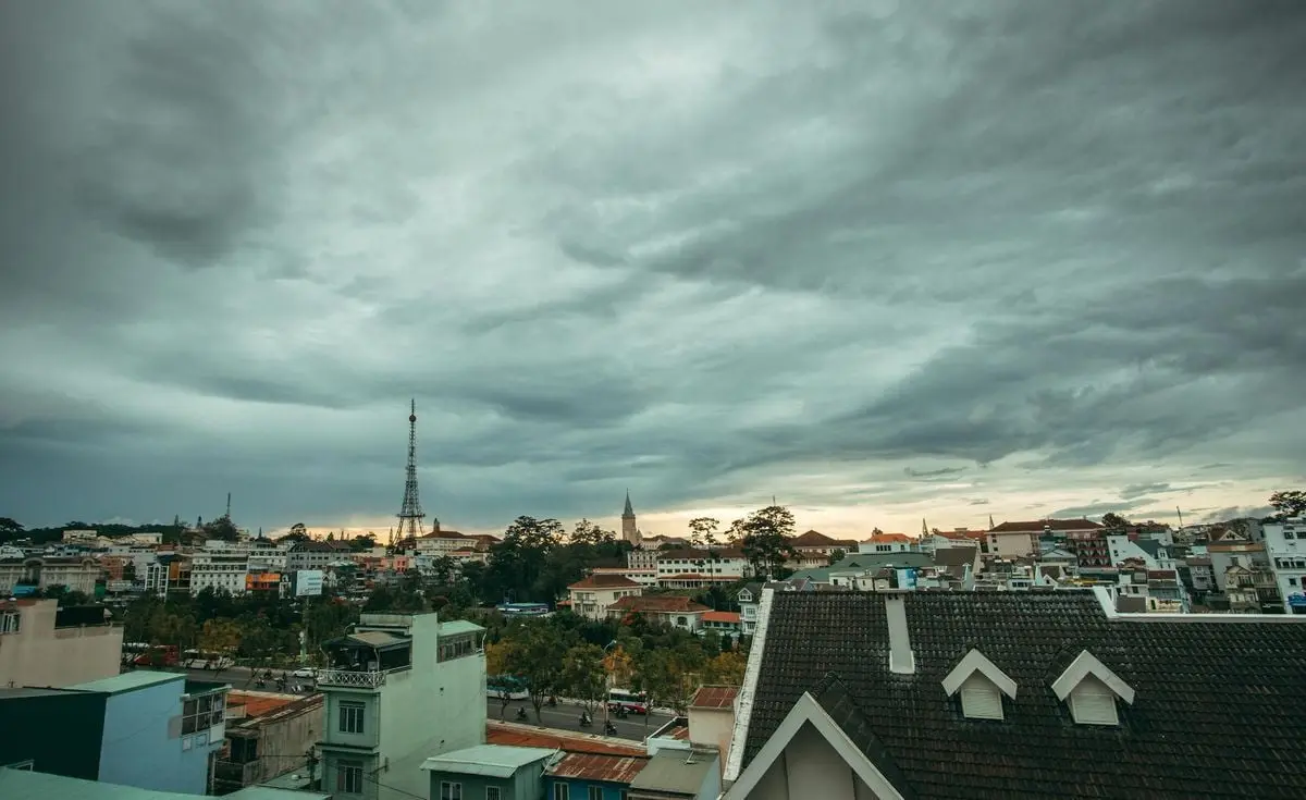 Aerial view of a small town with gray skies and diverse architecture