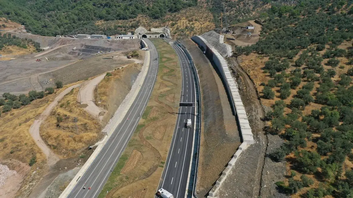Aerial view of highway and tunnel through a scenic Turkish landscape near Küçükçetmi.