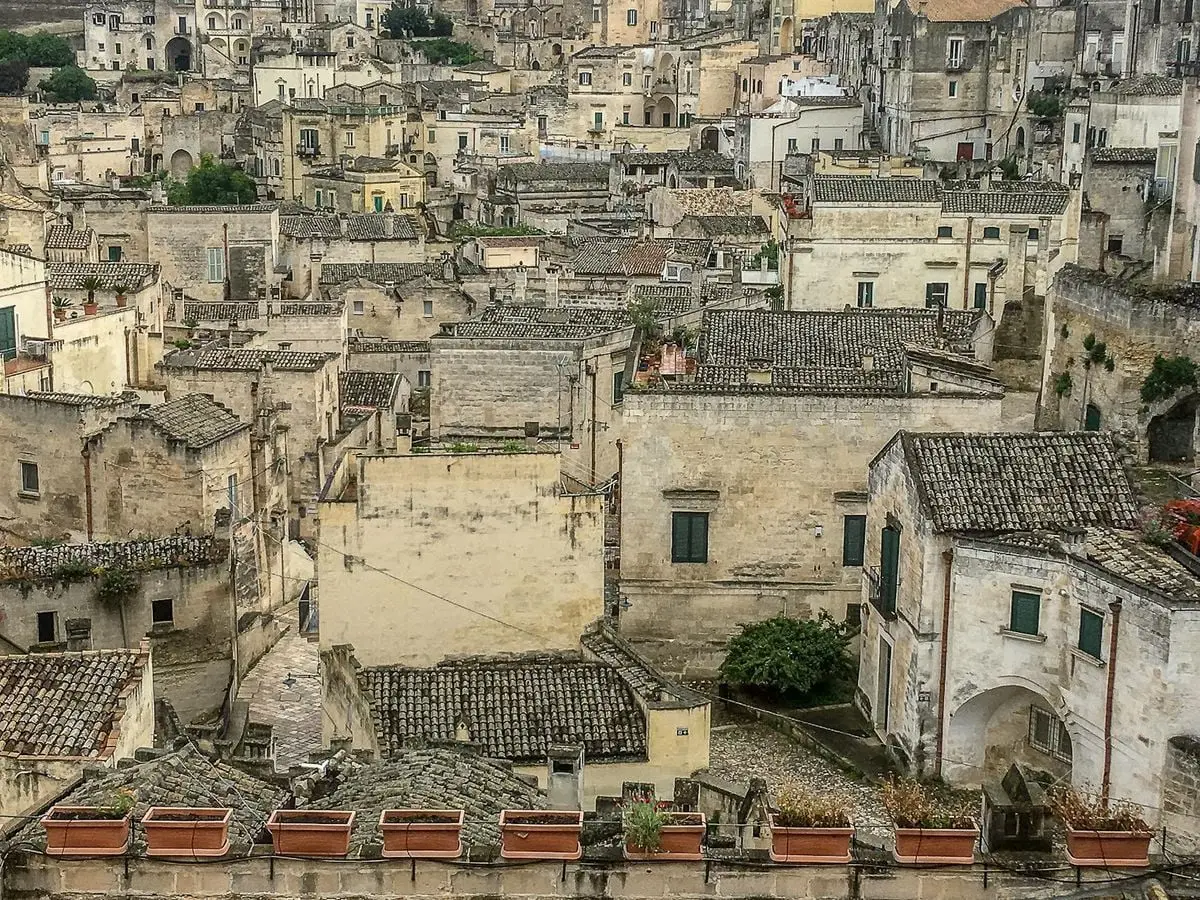 A picturesque view of the ancient stone architecture and rooftops of Matera, Italy.