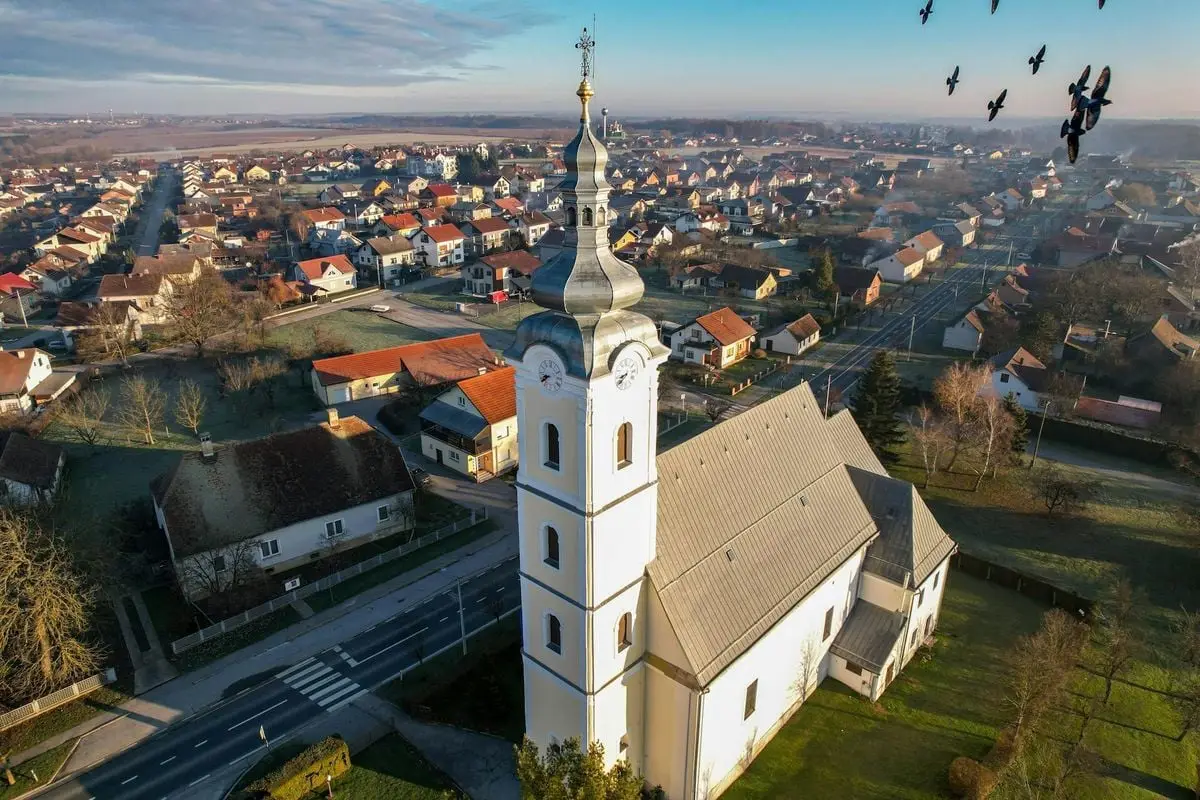 Aerial view of a Catholic church with a charming townscape in Garešnica, Croatia.